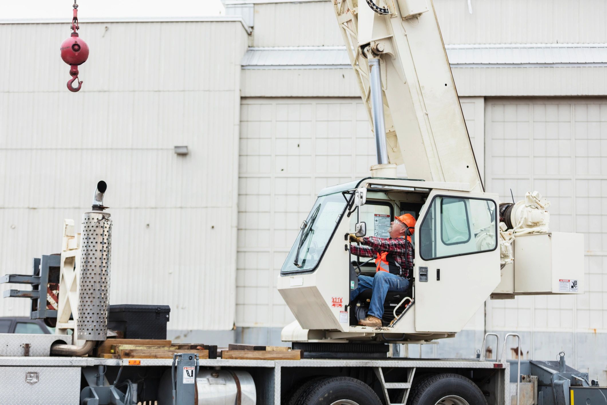 Heavy civil construction crane and equipment supporting active infrastructure work