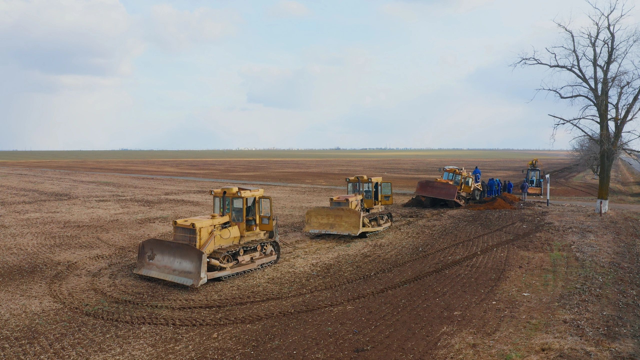 American heavy construction equipment working across an active infrastructure field